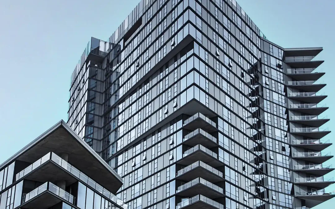 Glass-faced commercial building with tiered balconies